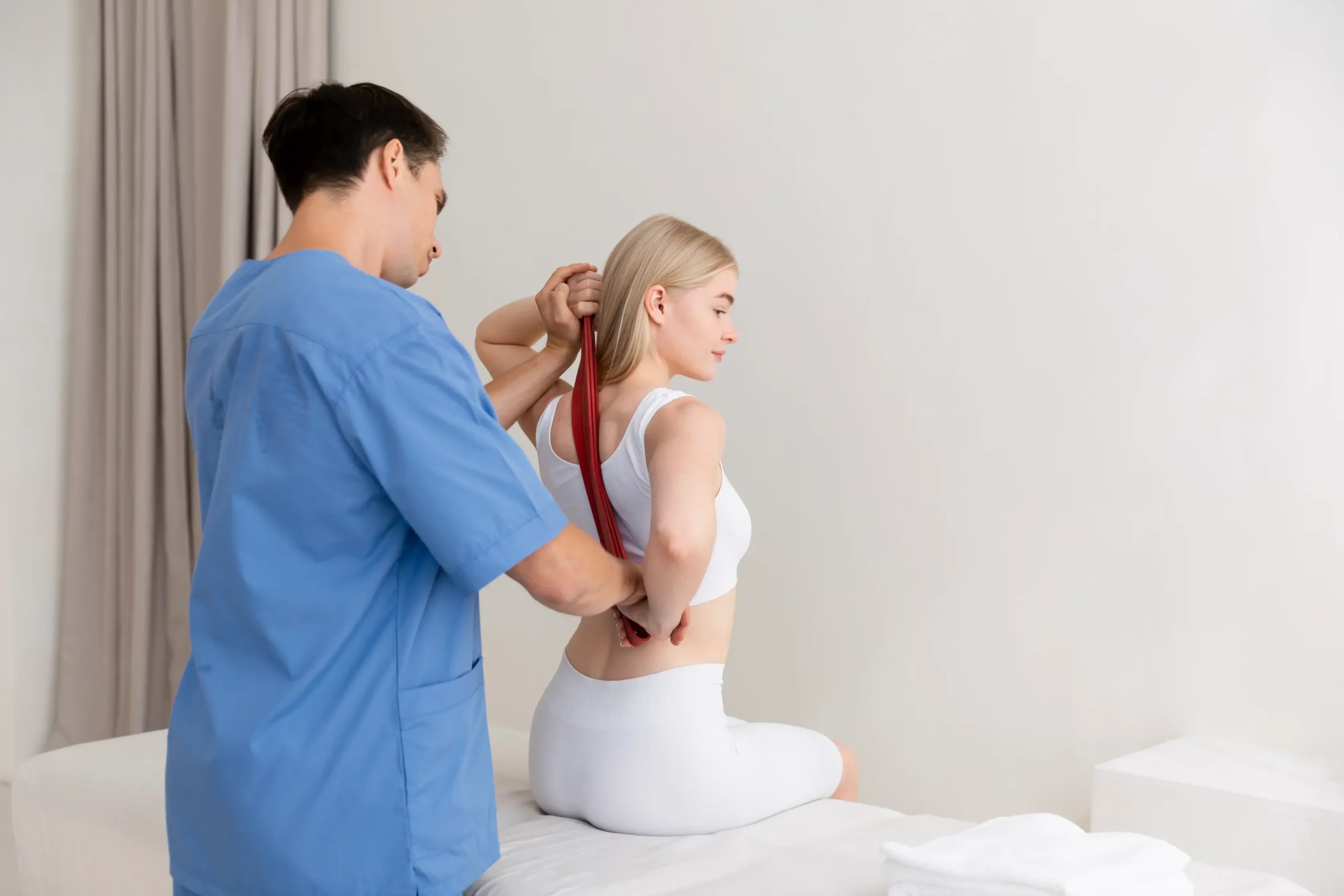 nurse with patient osteopathy session scaled